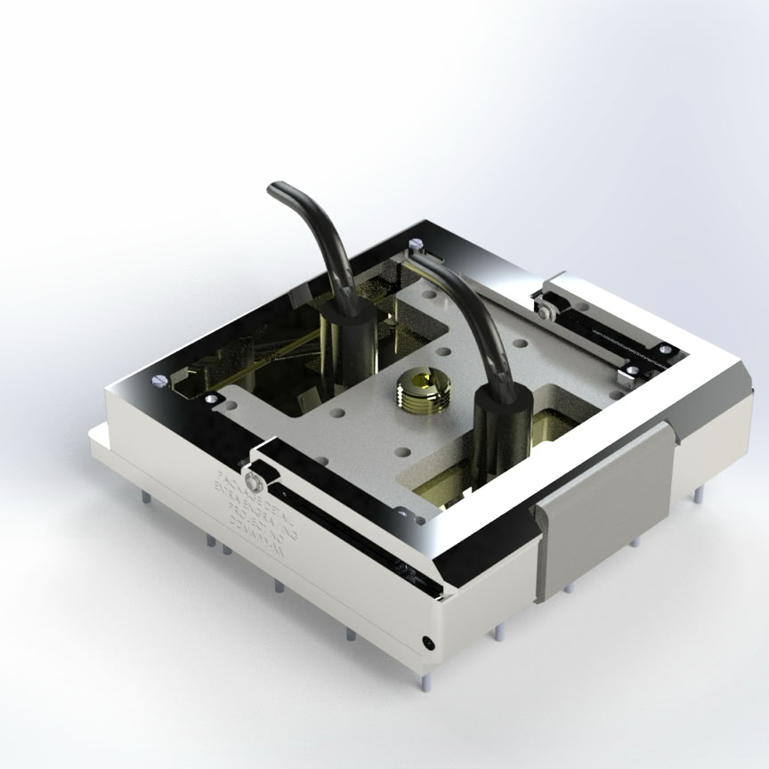 Detailed shot of a 3D printer nozzle operating in a workshop setting.